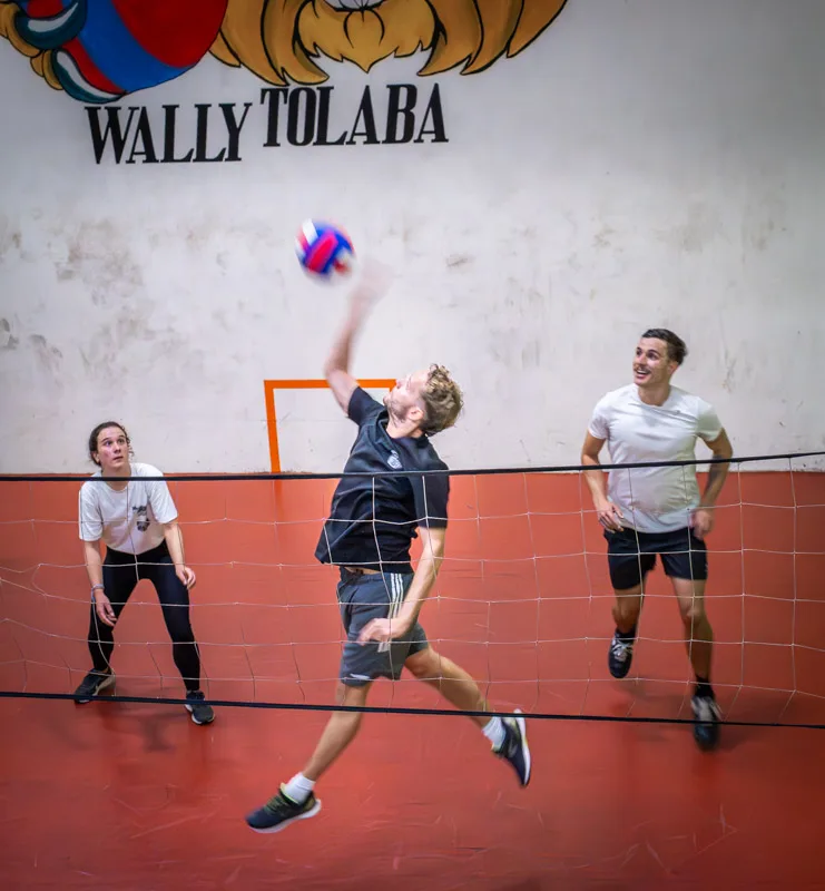 Three students playing wallyball together